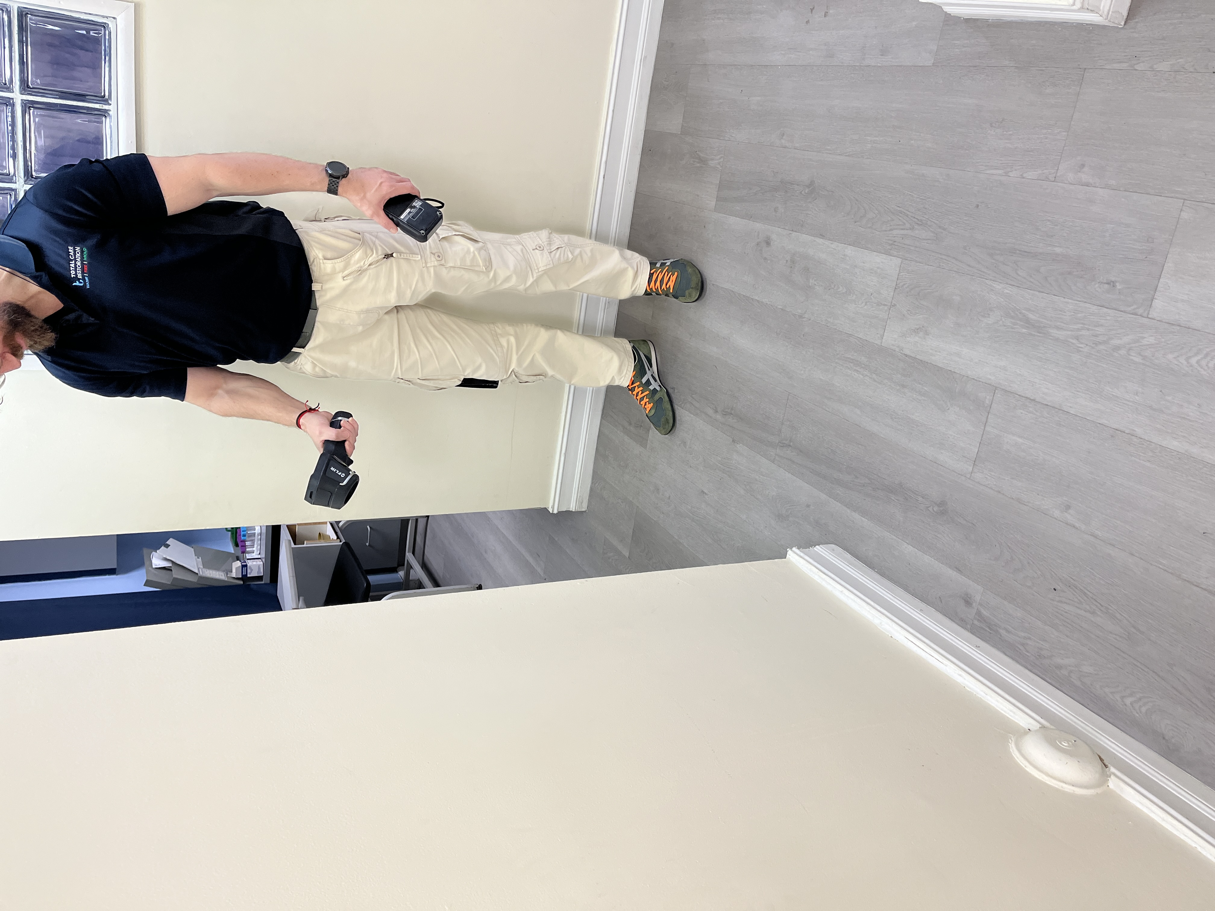 Professional leak detection technician performing thermal imaging inspection to locate hidden water leaks in South Florida home