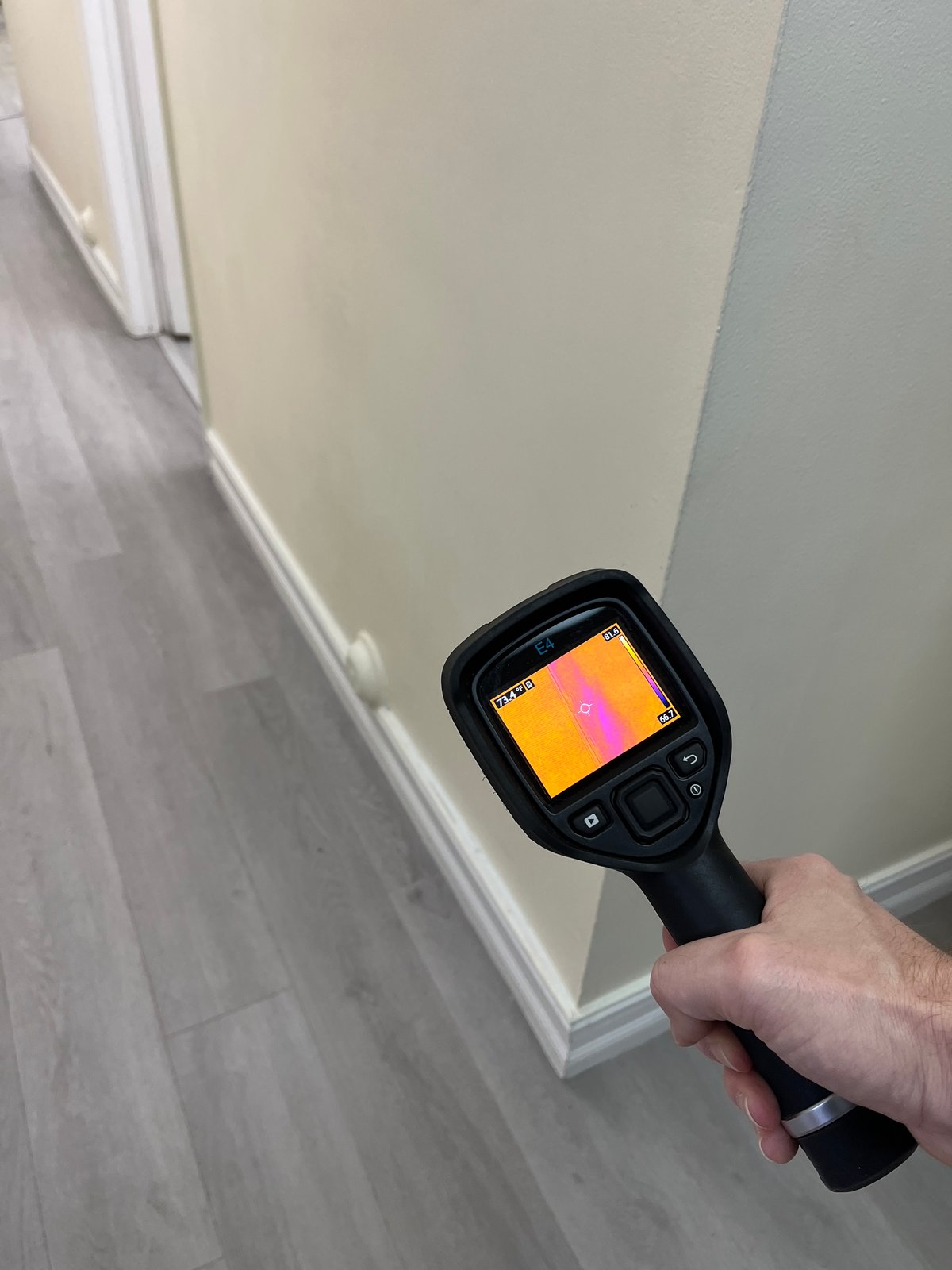 Professional leak detection equipment including thermal imaging camera and acoustic sensors used by South Florida technicians