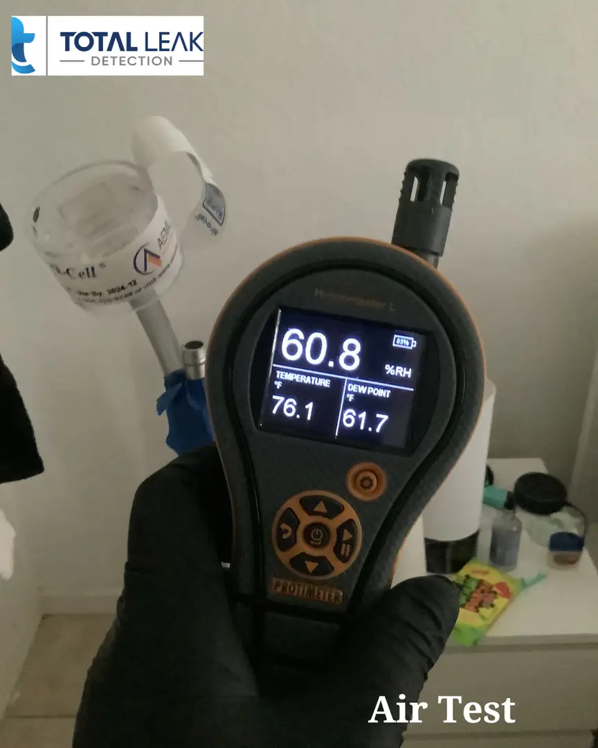 Air testing equipment setup for mold spore analysis in bathroom