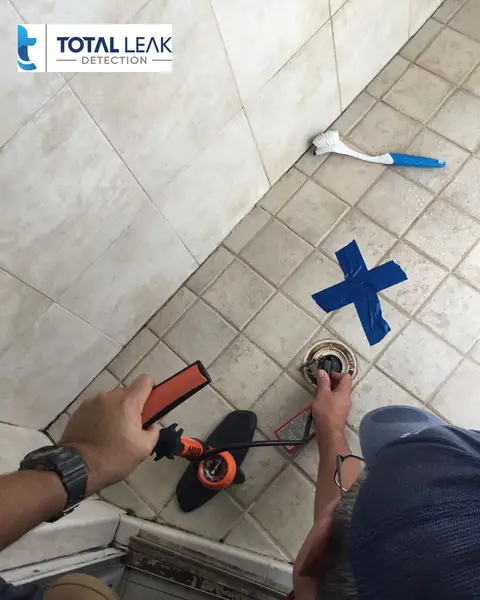 Leak detection specialist inspecting shower for hidden water leaks in Miami