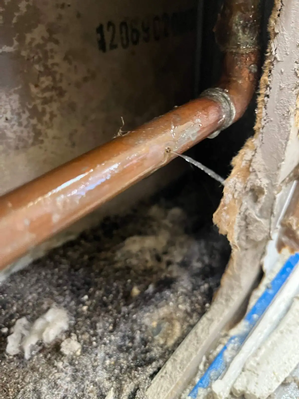 Close-up of drain pipe showing buildup that causes recurring clogs in residential plumbing