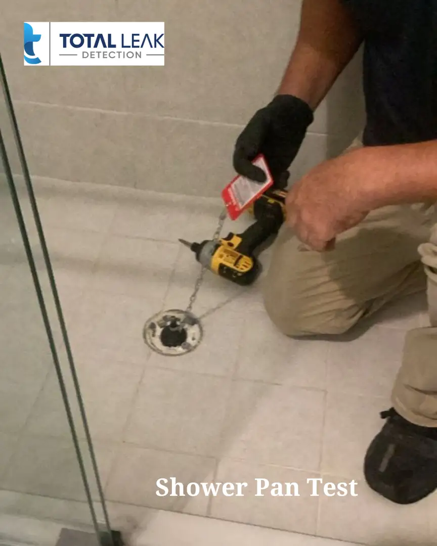 Specialized leak detection technician performing shower pan test