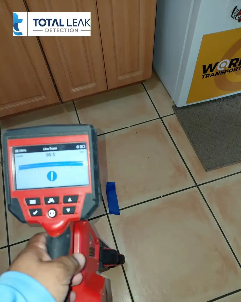 Electronic line tracing on a kitchen tile floor.
